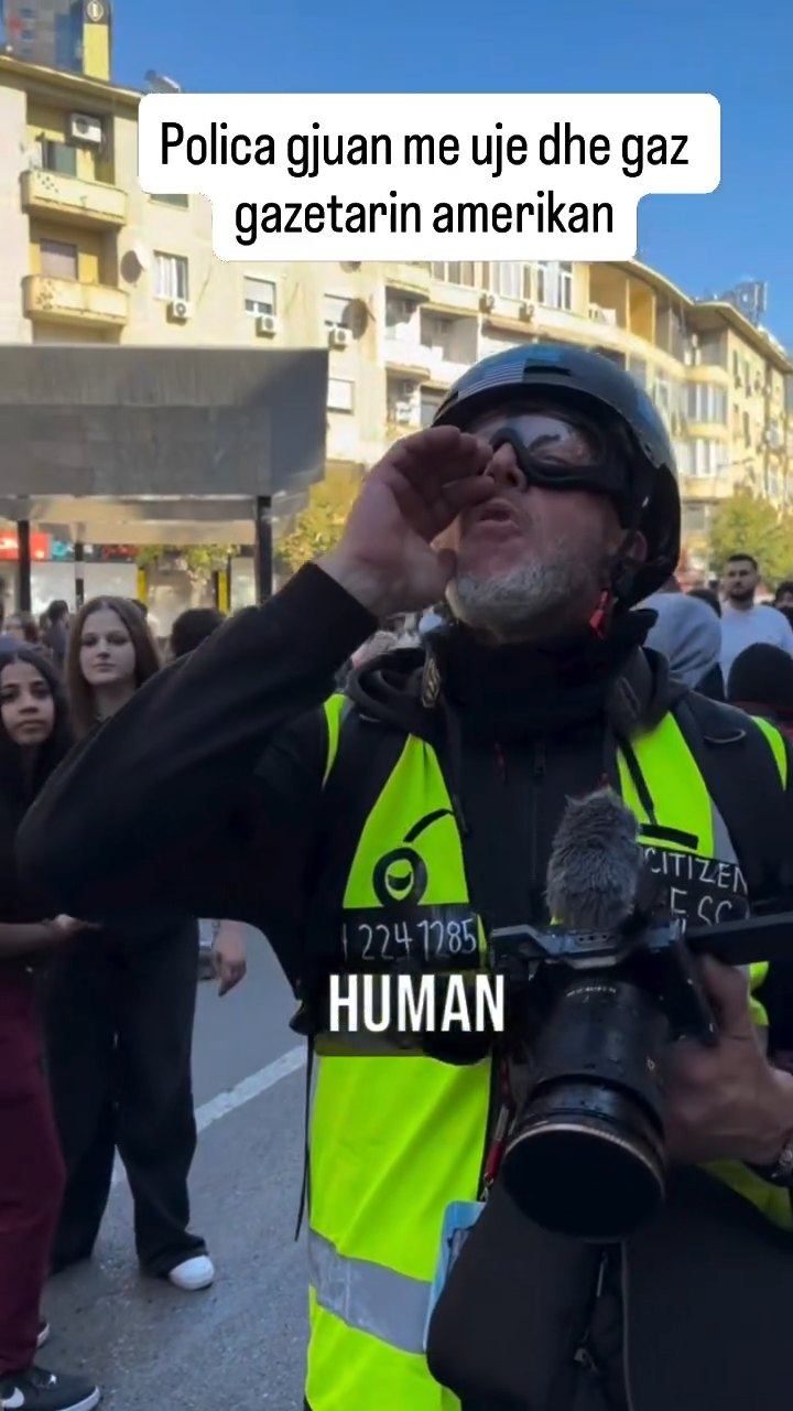Police fire water and tear gas at an American journalist